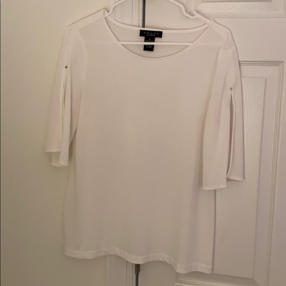 Elegant white blouse with cut sleeves